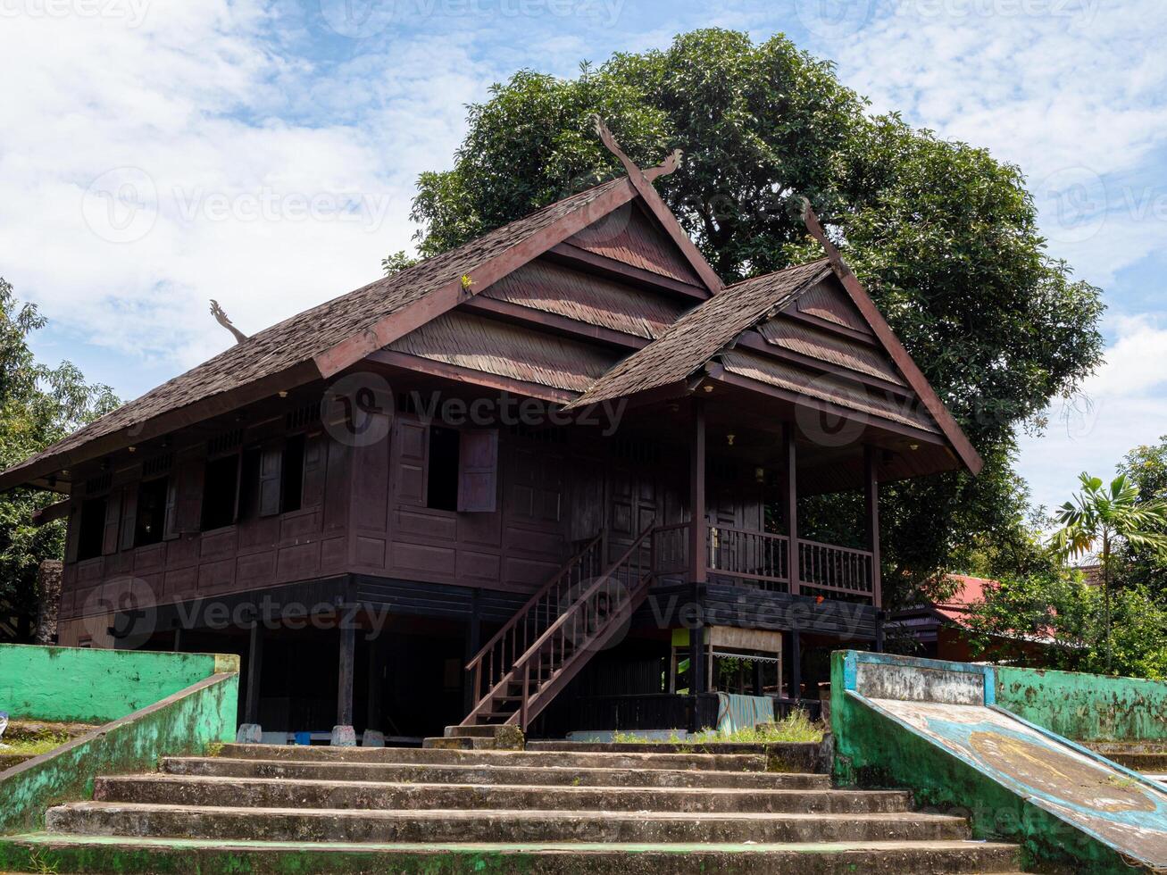 A low angle shot of aged Traditional ethnic house from Selayar island regency South Sulawesi Indonesia in bright sun photo