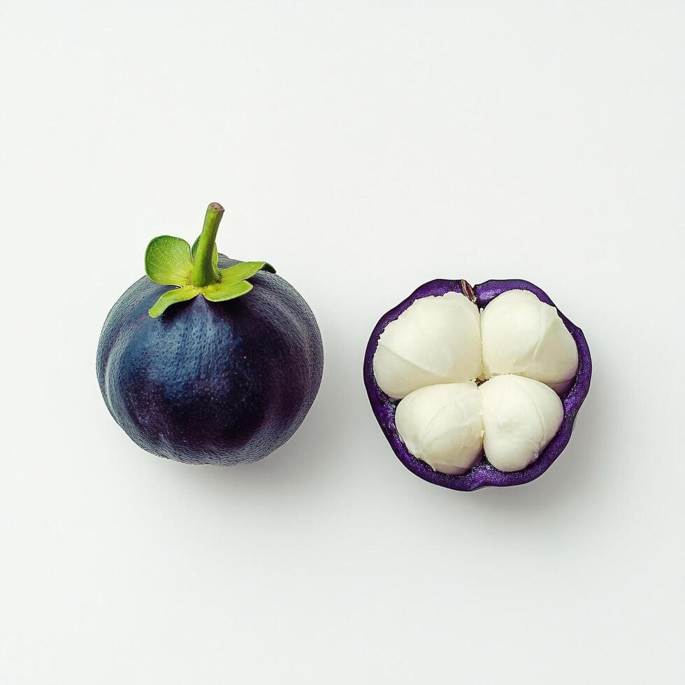 Vibrant Purple Mangosteen Fruit Whole and Halved Isolated on White Background photo
