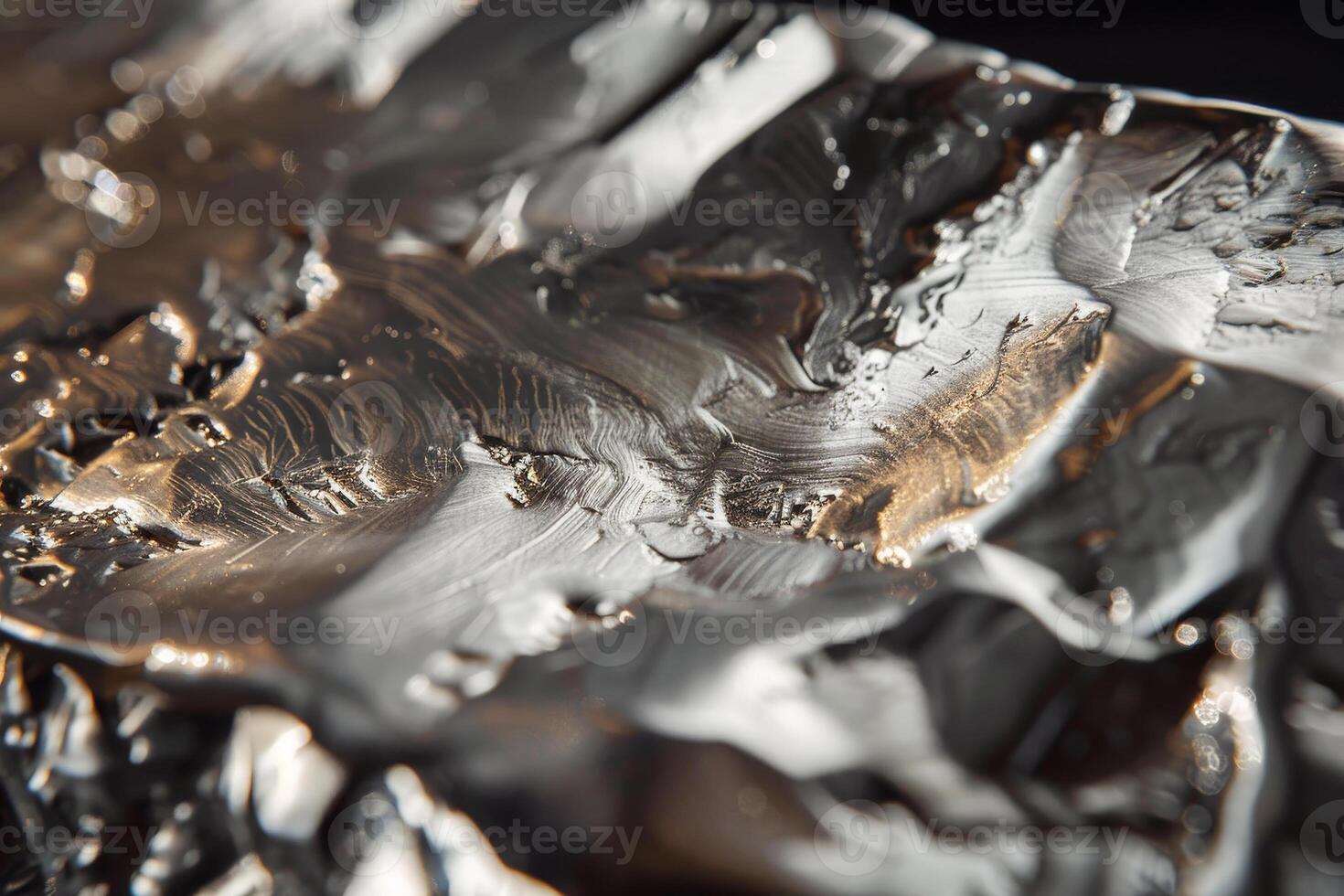 A close up of a piece of foil with silver paint photo