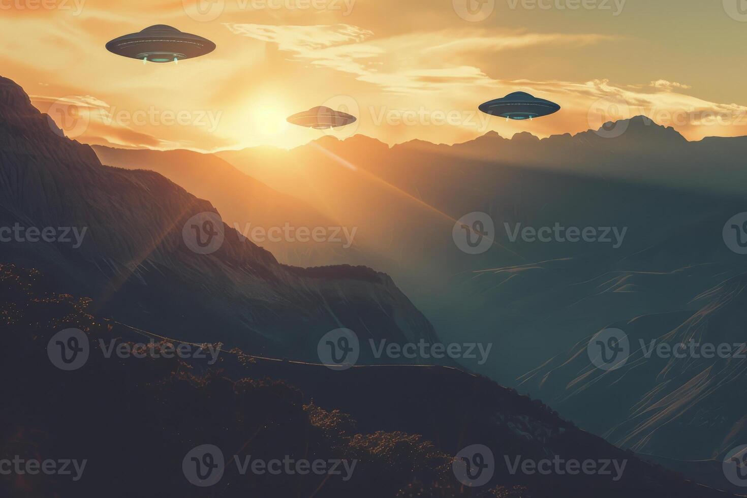 Three alien spaceships flying over a mountain range at sunset photo