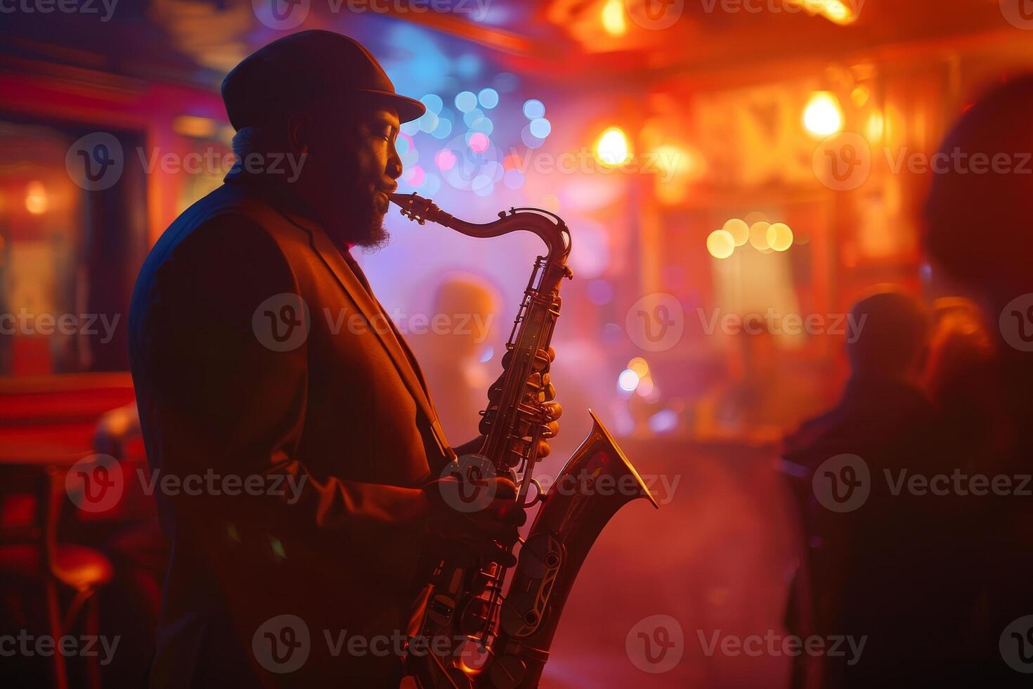 A man in a suit playing the saxophone in a bar photo