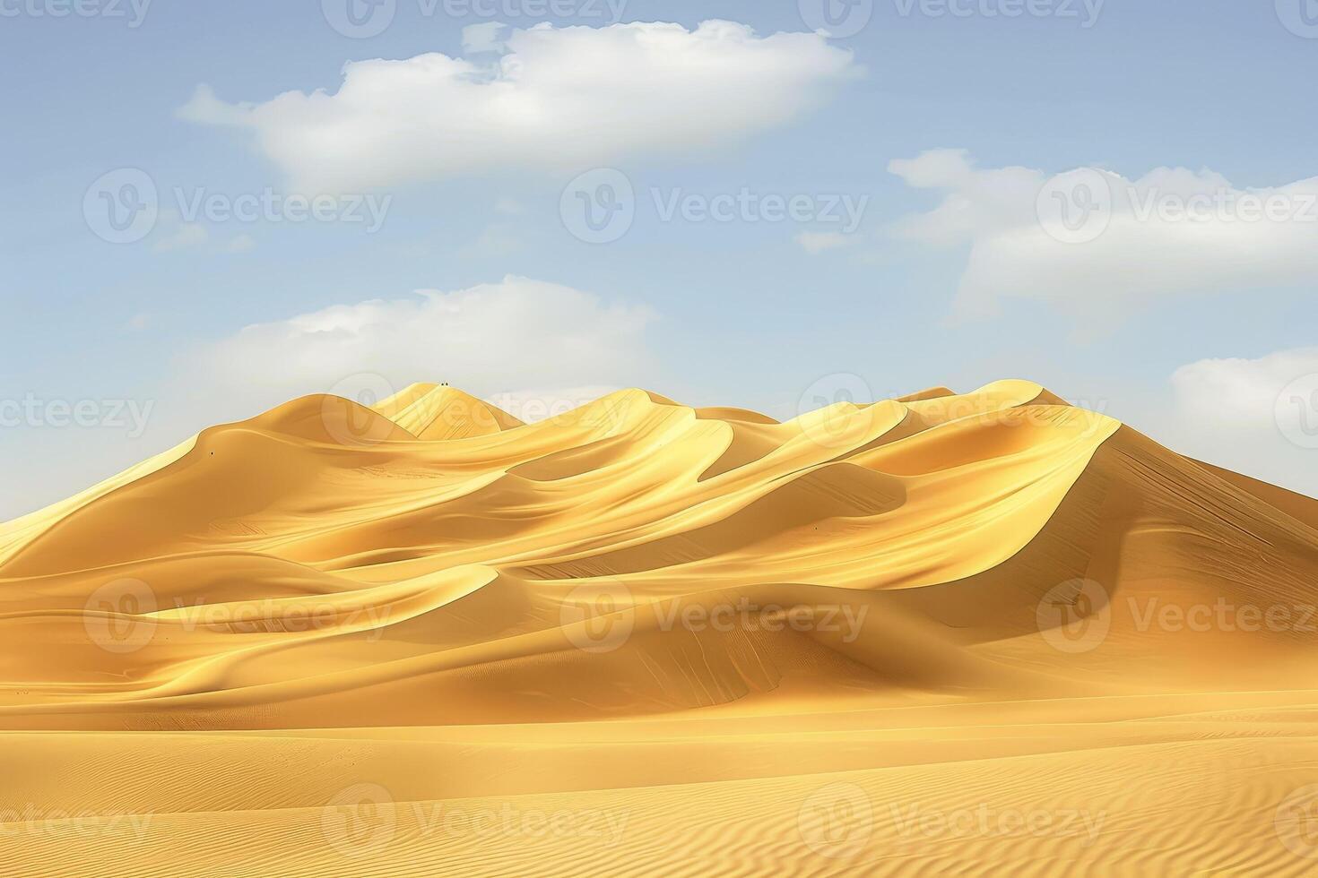 A desert with sand dunes and clouds photo