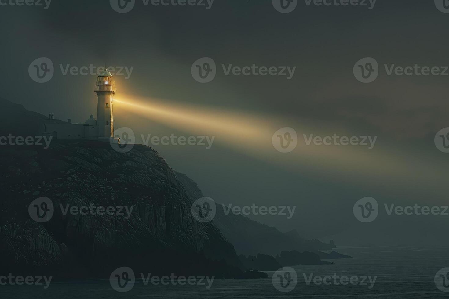 A lighthouse is lit up by the sun on a foggy day photo