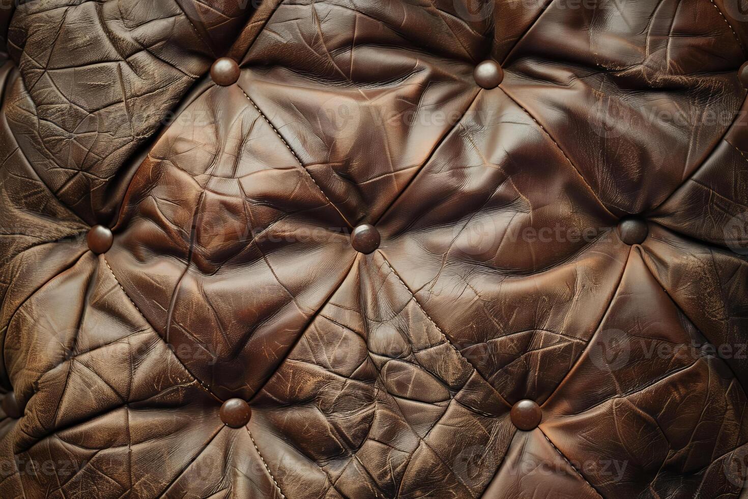 Close up of a brown leather sofa with buttons photo