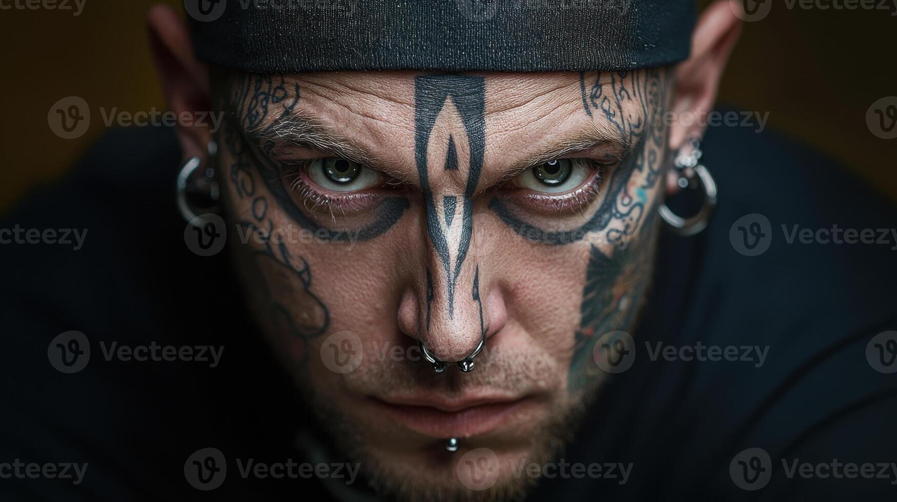 A man with tattoos on his face photo