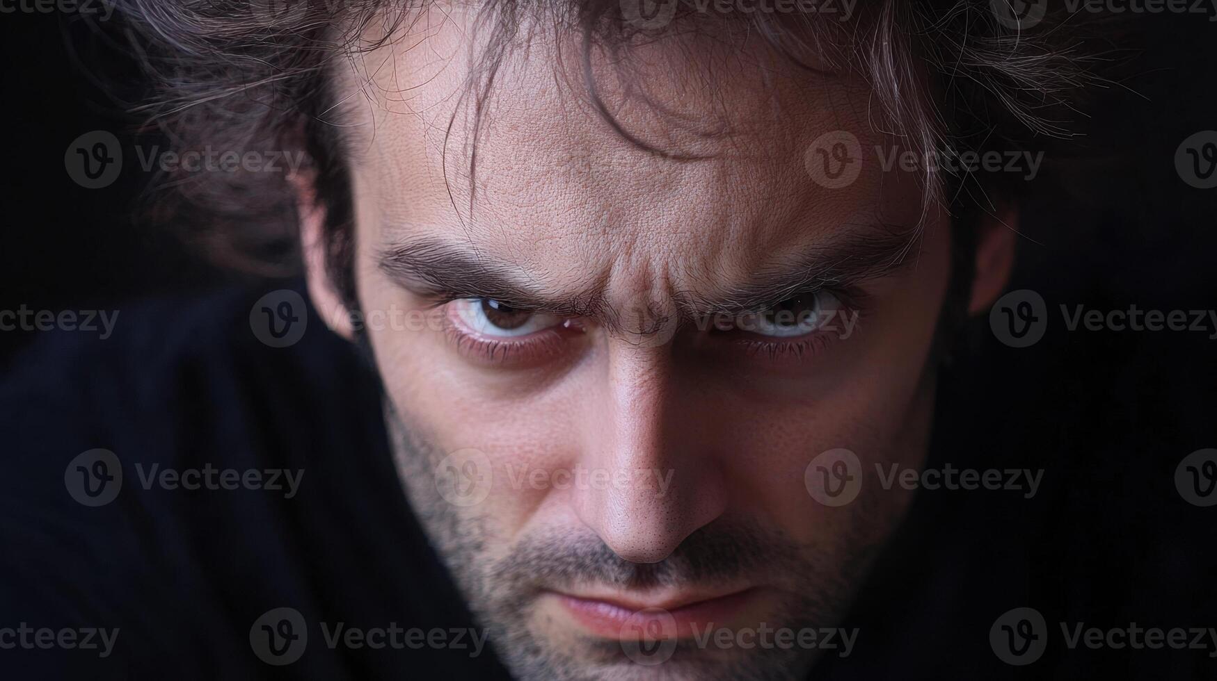 A man with a serious expression on his face photo