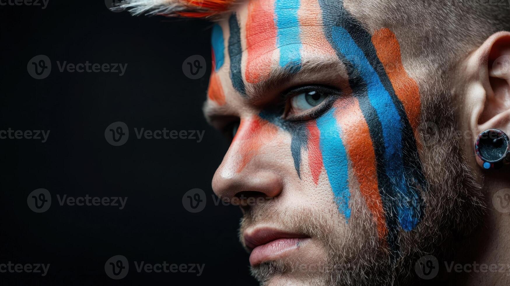 A man with colorful paint on his face photo
