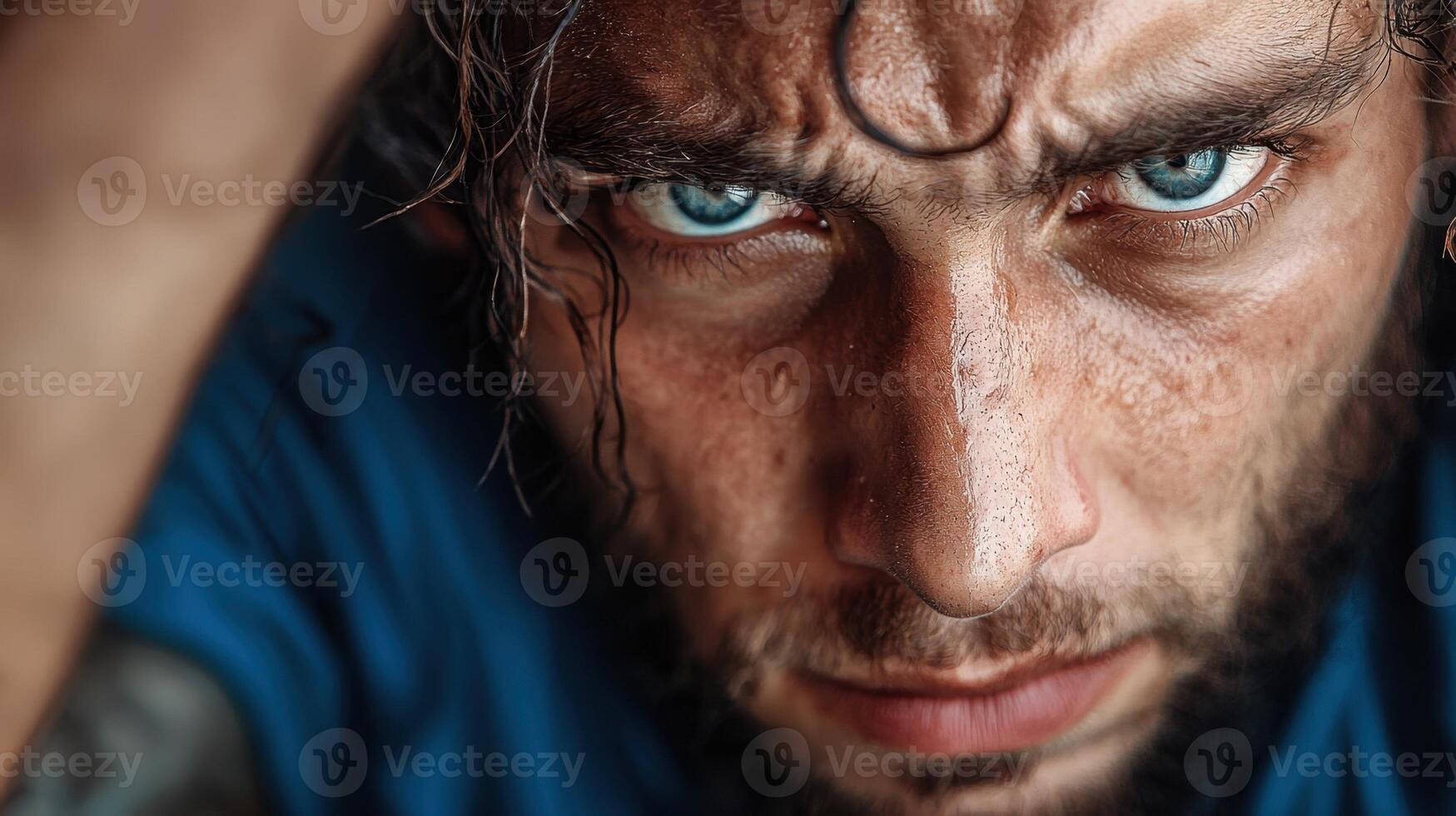 A man with blue eyes and a beard photo