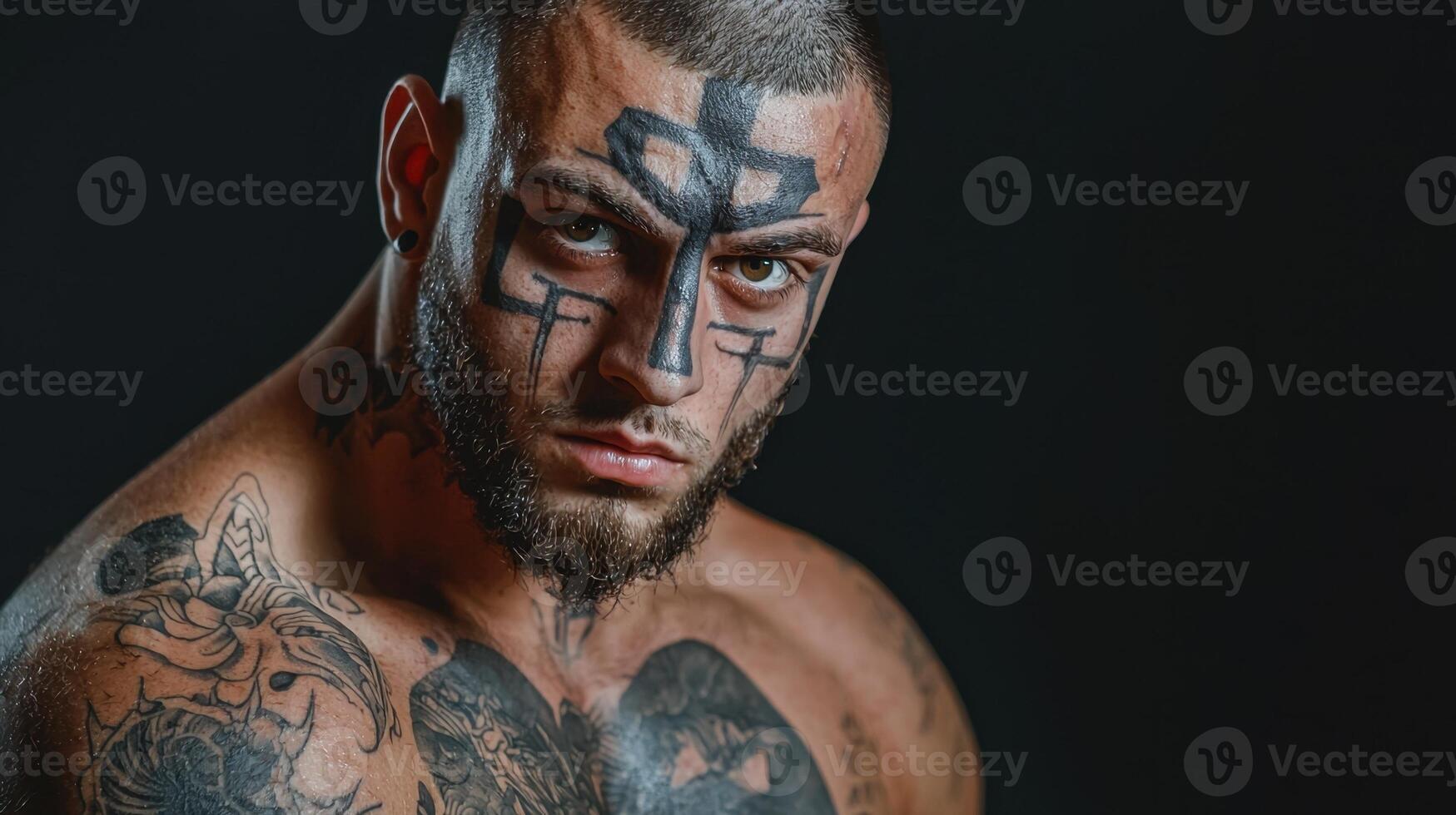 A man with tattoos on his face photo