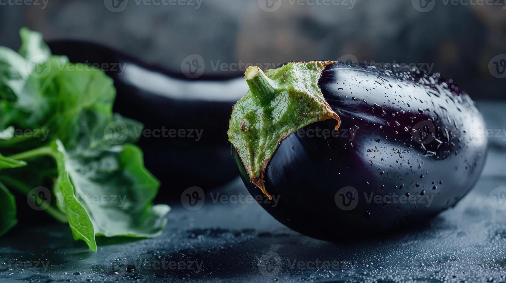 A close up of two eggplants with leaves photo