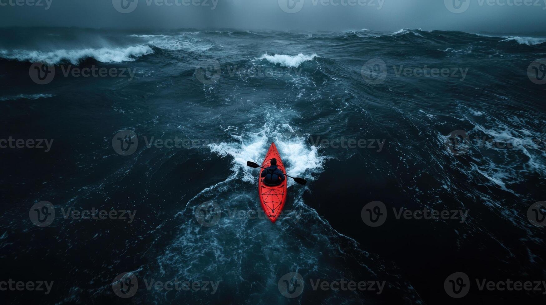 A kayaker in the middle of a large ocean photo