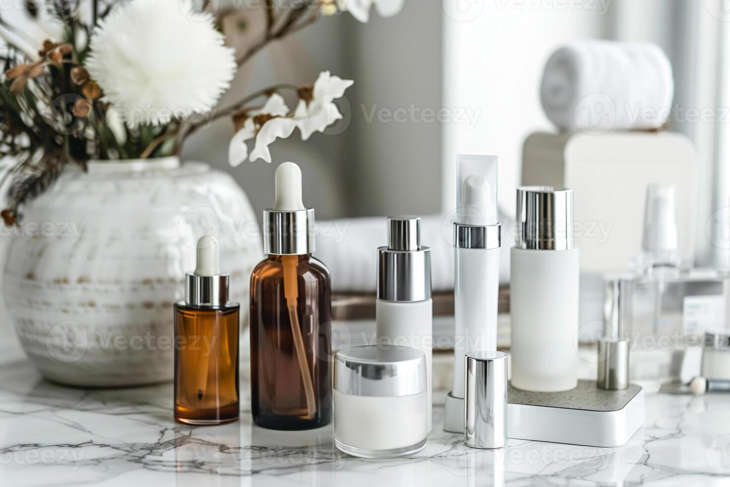 A collection of beauty products are displayed on a marble countertop photo