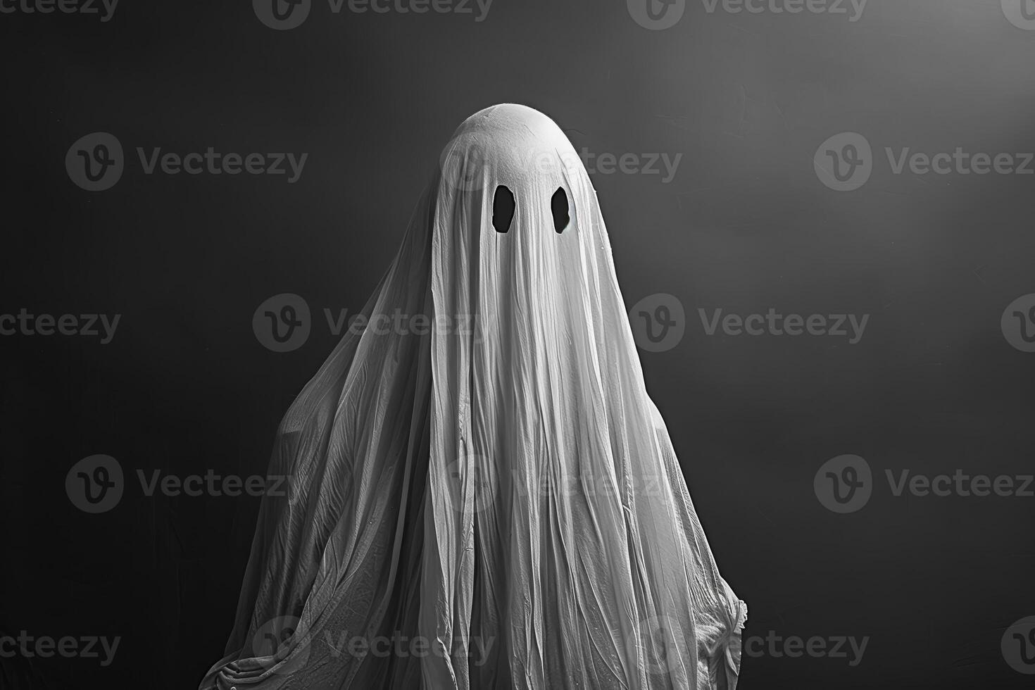 A ghostly figure is standing in front of a dark background photo