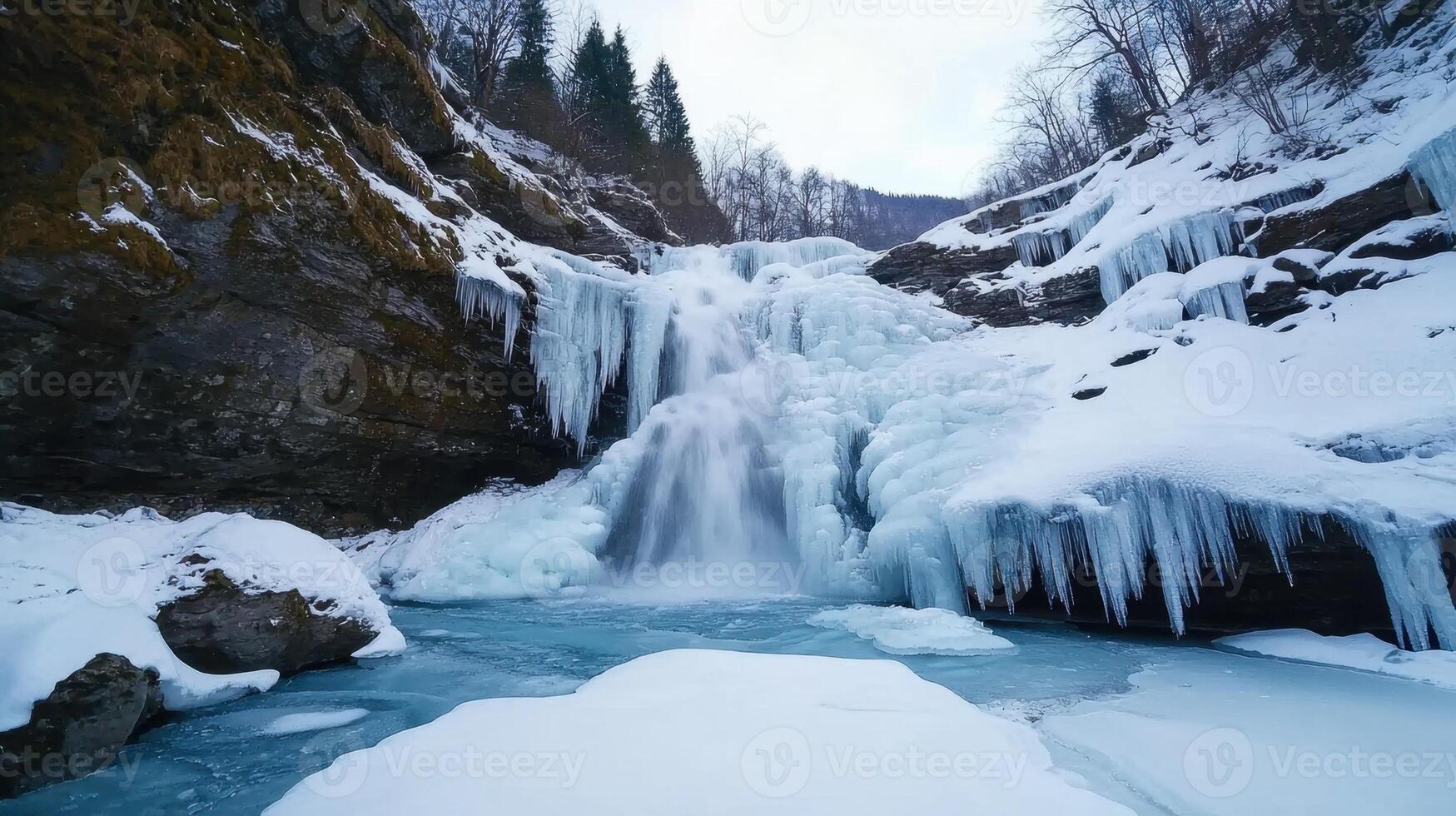 A waterfall is covered in ice and snow photo