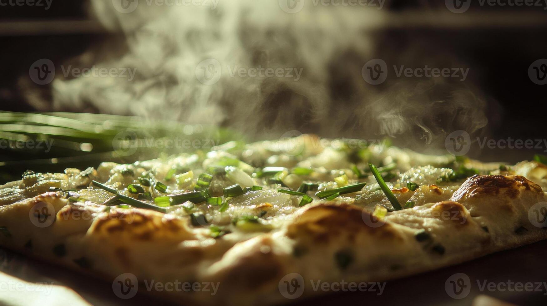 A pizza with green onions and cheese photo