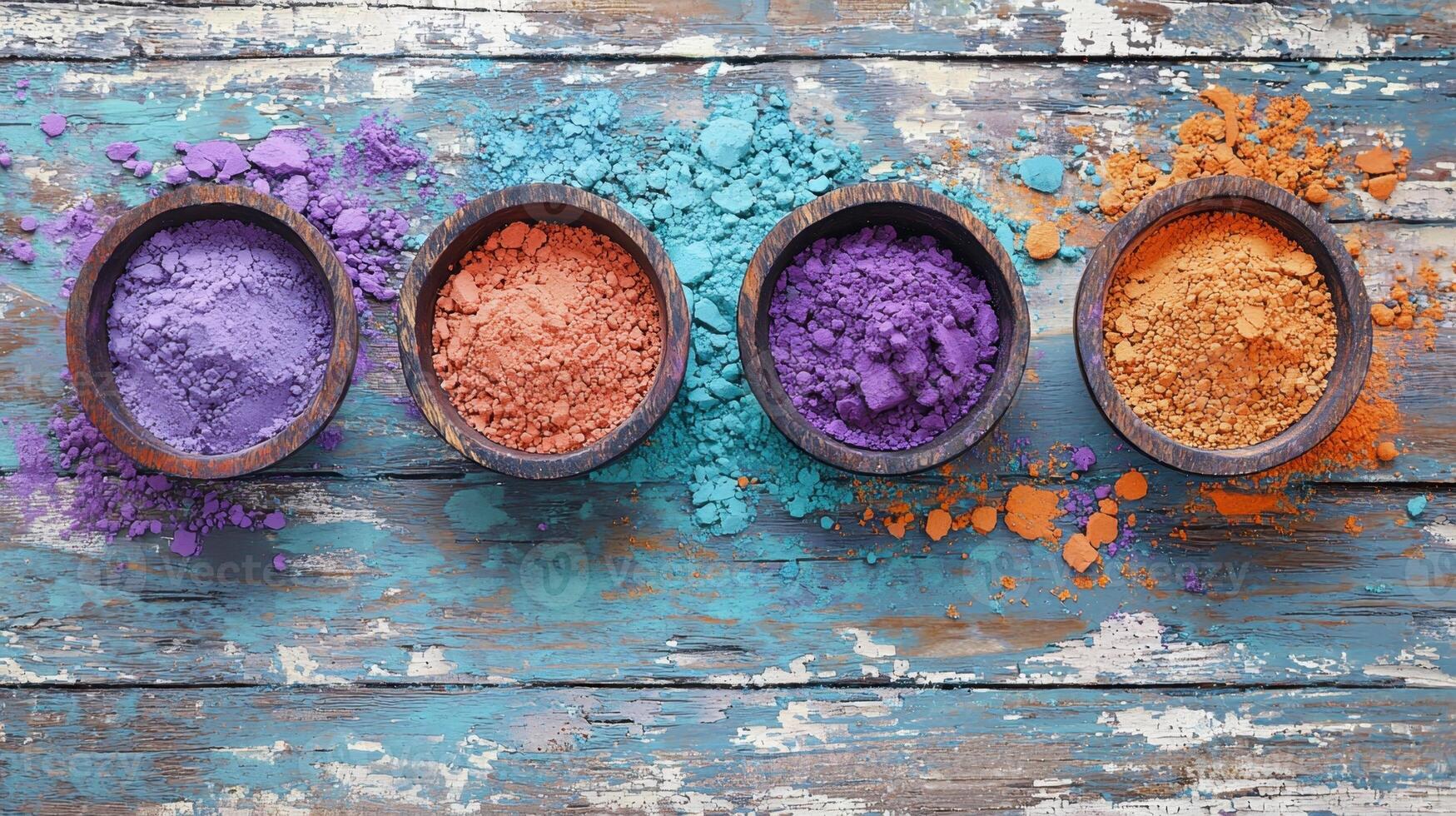 Colorful powders in bowls on a wooden table photo
