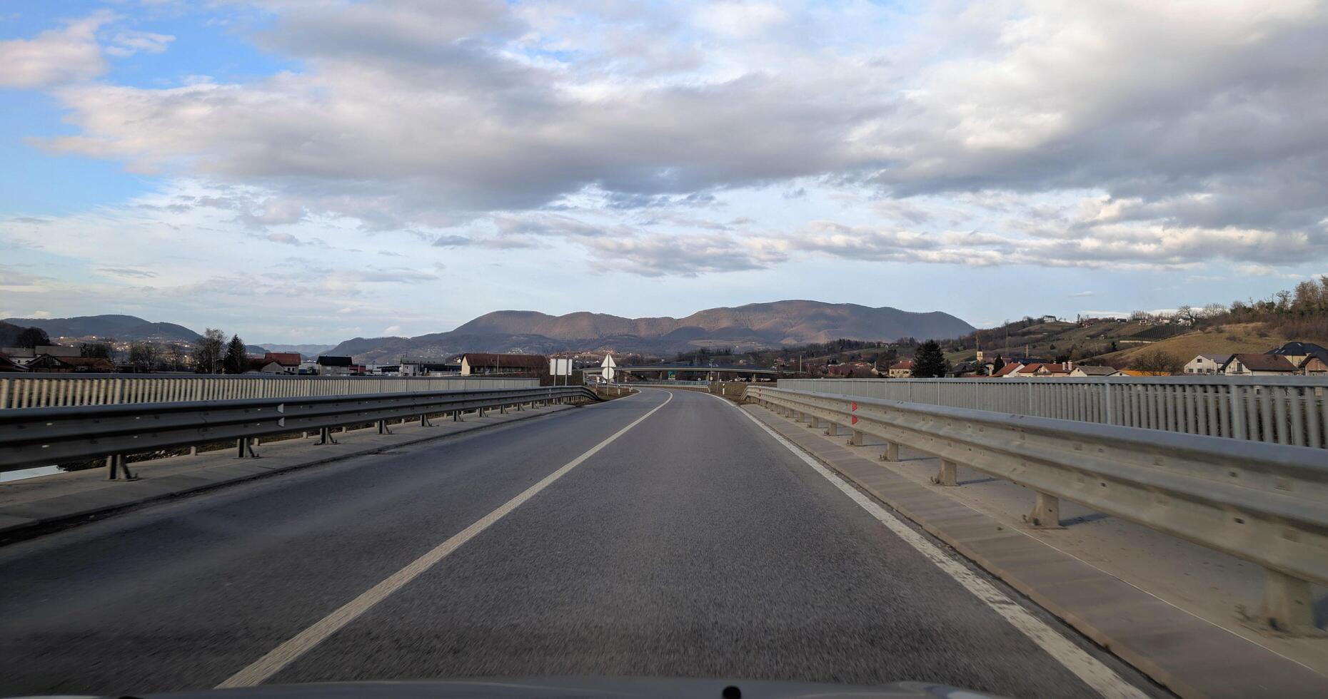 Empty highway road with mountains in background near Krapina, Croatia, Hrvatsko zagorje photo