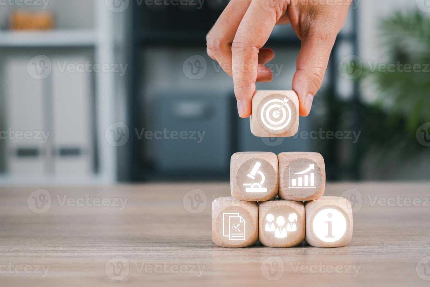 Wooden blocks with business icons representing market research, strategy, and analysis for planning and growth. photo