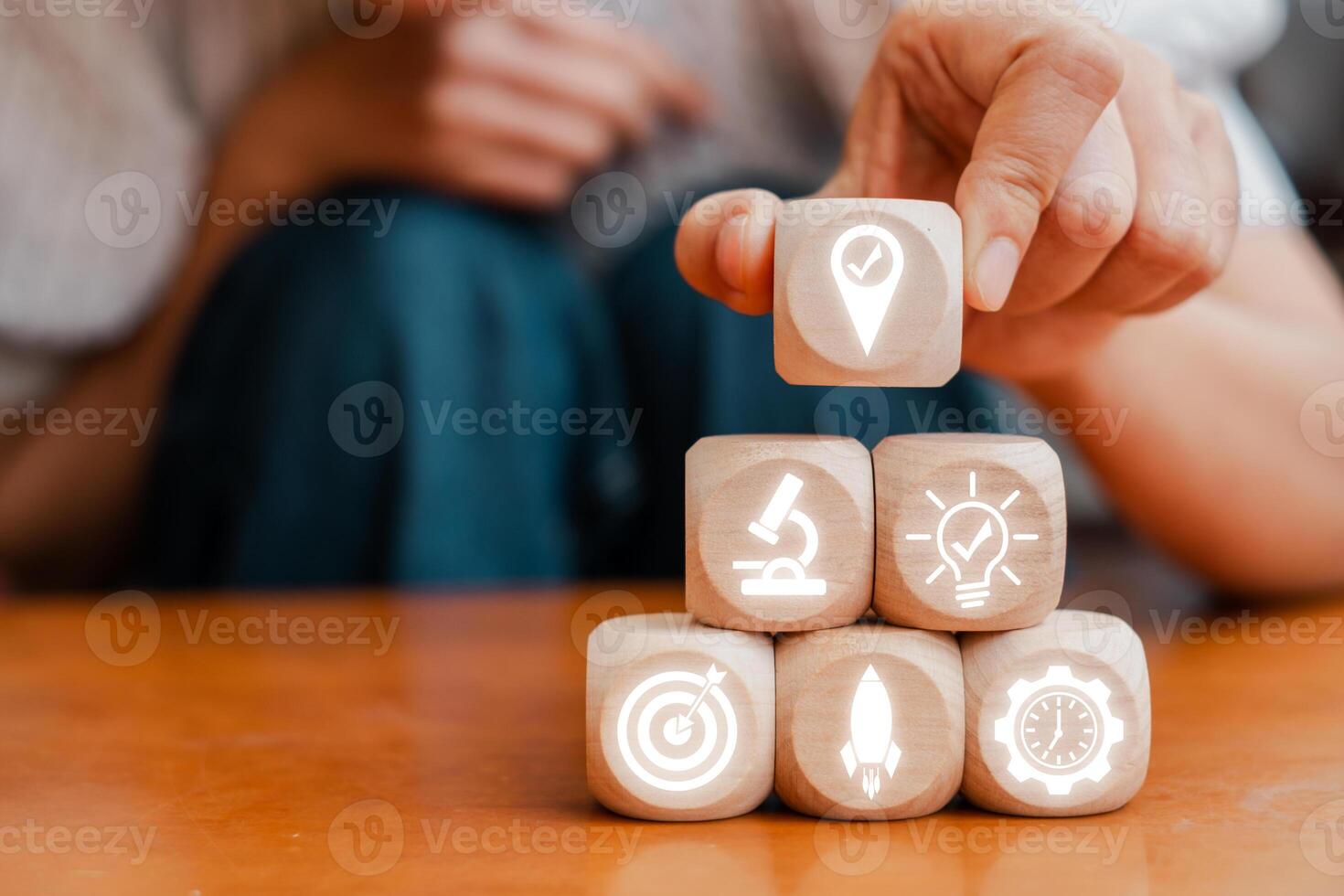 Wooden blocks with icons representing strategic planning, innovation, and success in business. Ideal for illustrating growth concepts. photo