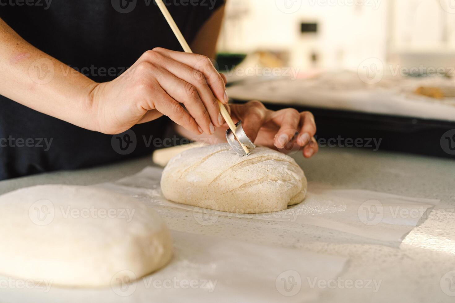 Woman preparing sourdough bread at home photo