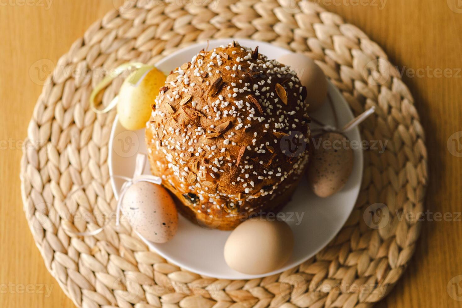 Baking a festive easter panettone with icing on a kitchen countertop during springtime preparations photo