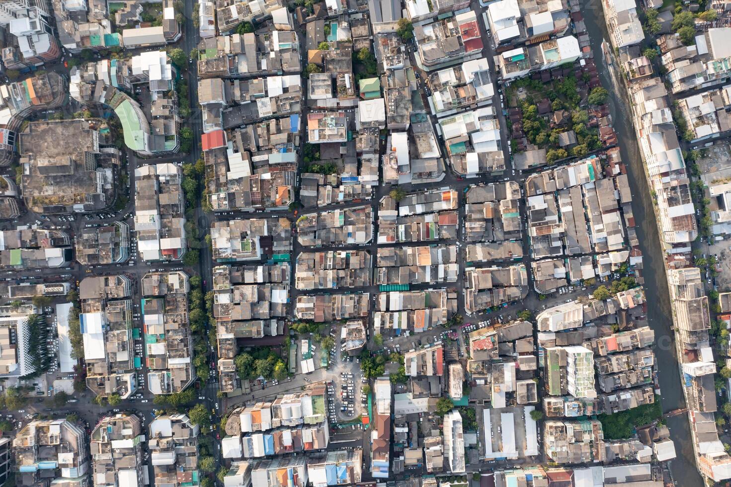 A high shot topview reveals the endless maze of houses and housing that make up the bustling city of Bangkok, each one teeming with activity. shot date 6 Nov 2018. photo