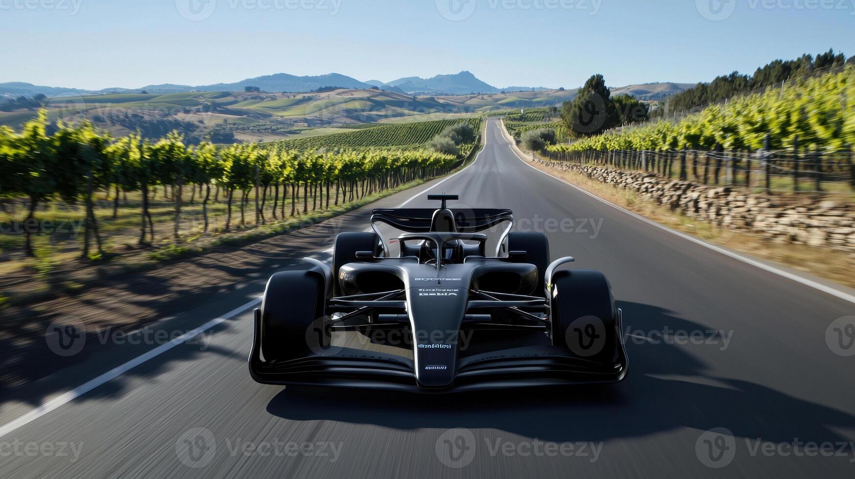 The car is sleek and powerful, and the road is winding and curvy photo