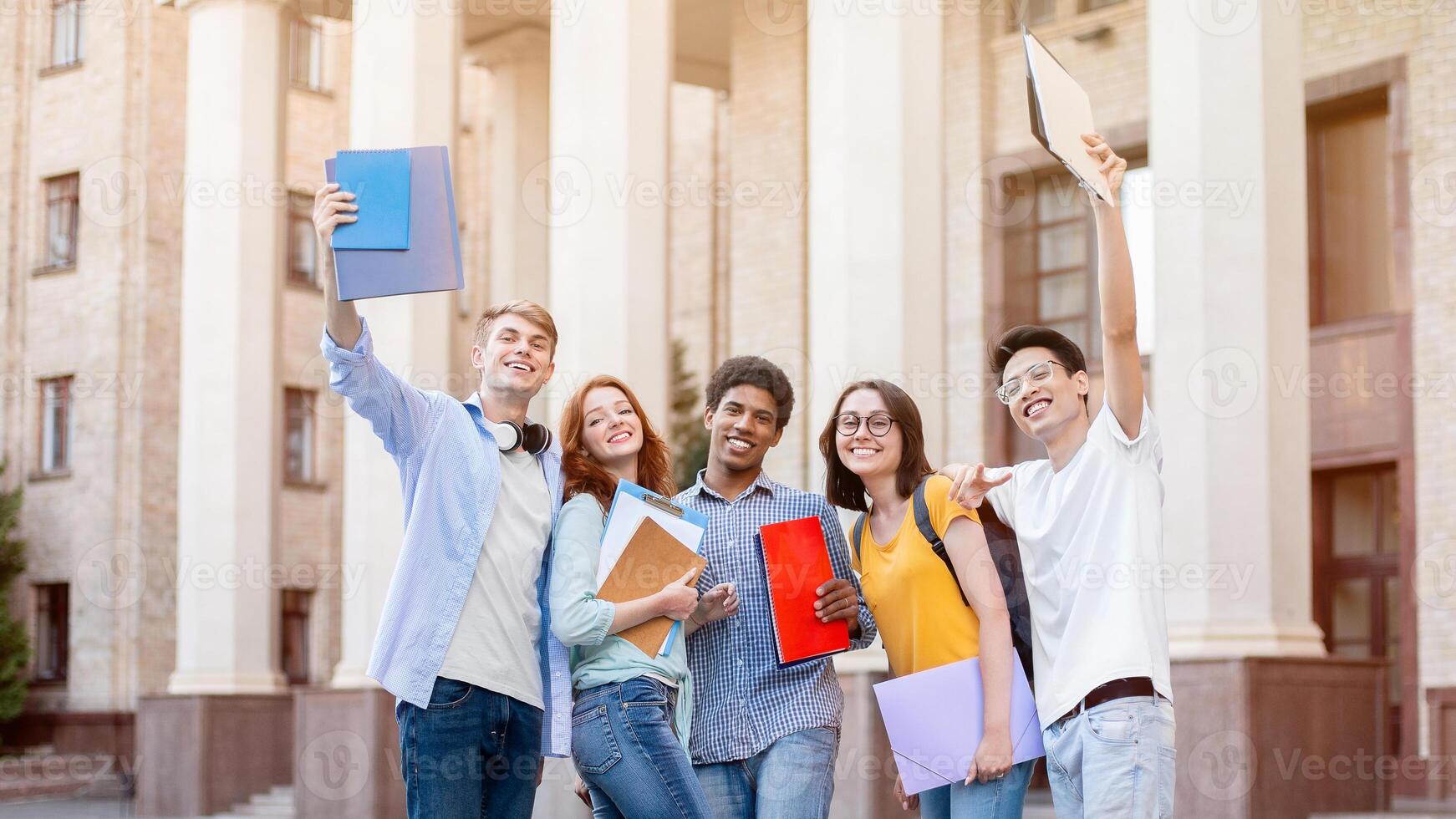 Cheerful Diverse Students Posing Smiling To Camera Standing Outside University Building. Higher Education Concept photo