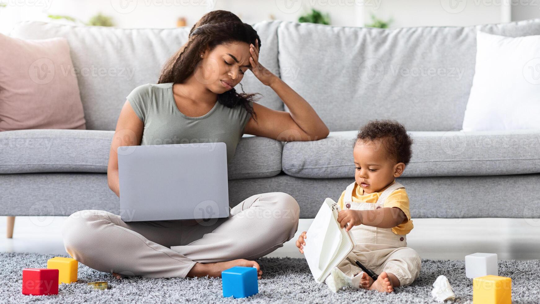 Motherhood Challenges. Stressed Woman Trying To Work On Laptop With Little Baby Boy Playing Around, Annoyed Mom Suffering Troubles With Remote Job While Babysitting Her Infant Child, Free Space photo