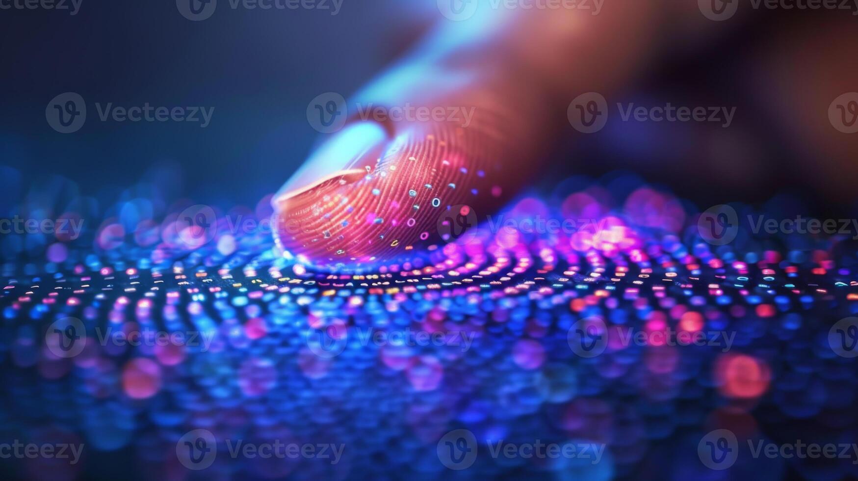 A finger gently touches a digital surface illuminated with colorful lights, creating an intricate pattern of dynamic, glowing dots. The scene showcases advanced technology. photo