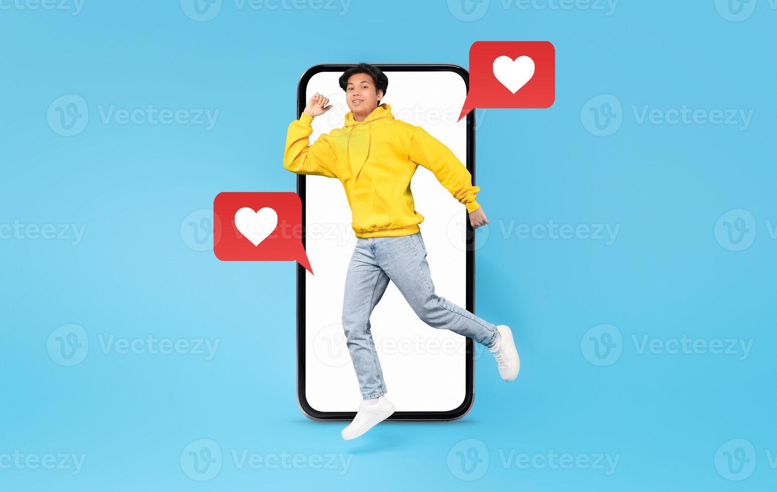 A young person in a yellow hoodie joyfully interacts with their smartphone, surrounded by heart icons representing social media and messages. This moment captures the excitement of modern dating. photo