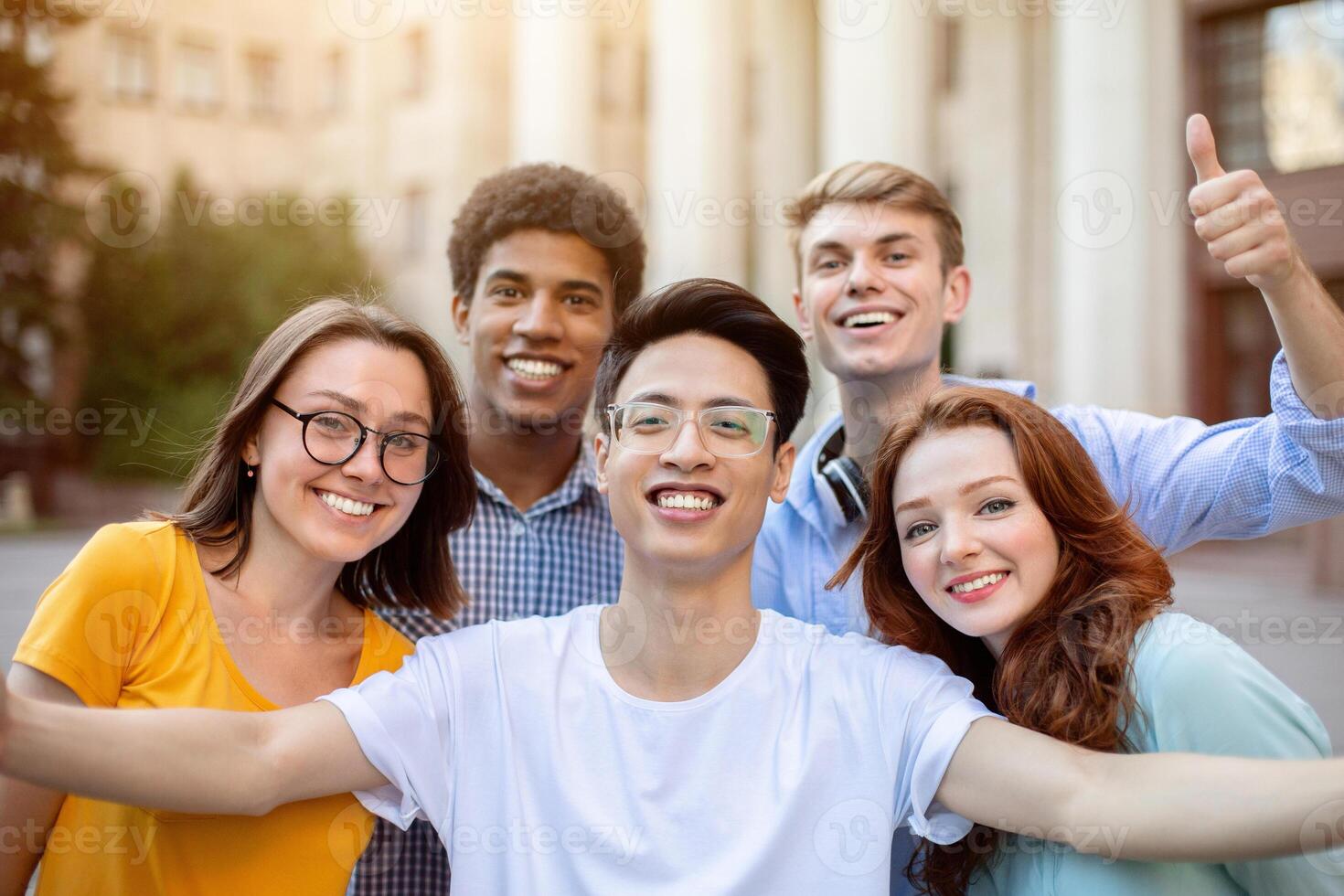 Cheerful Multicultural Students Posing Together Making Selfie Near University Building Outdoors. College Education Concept photo