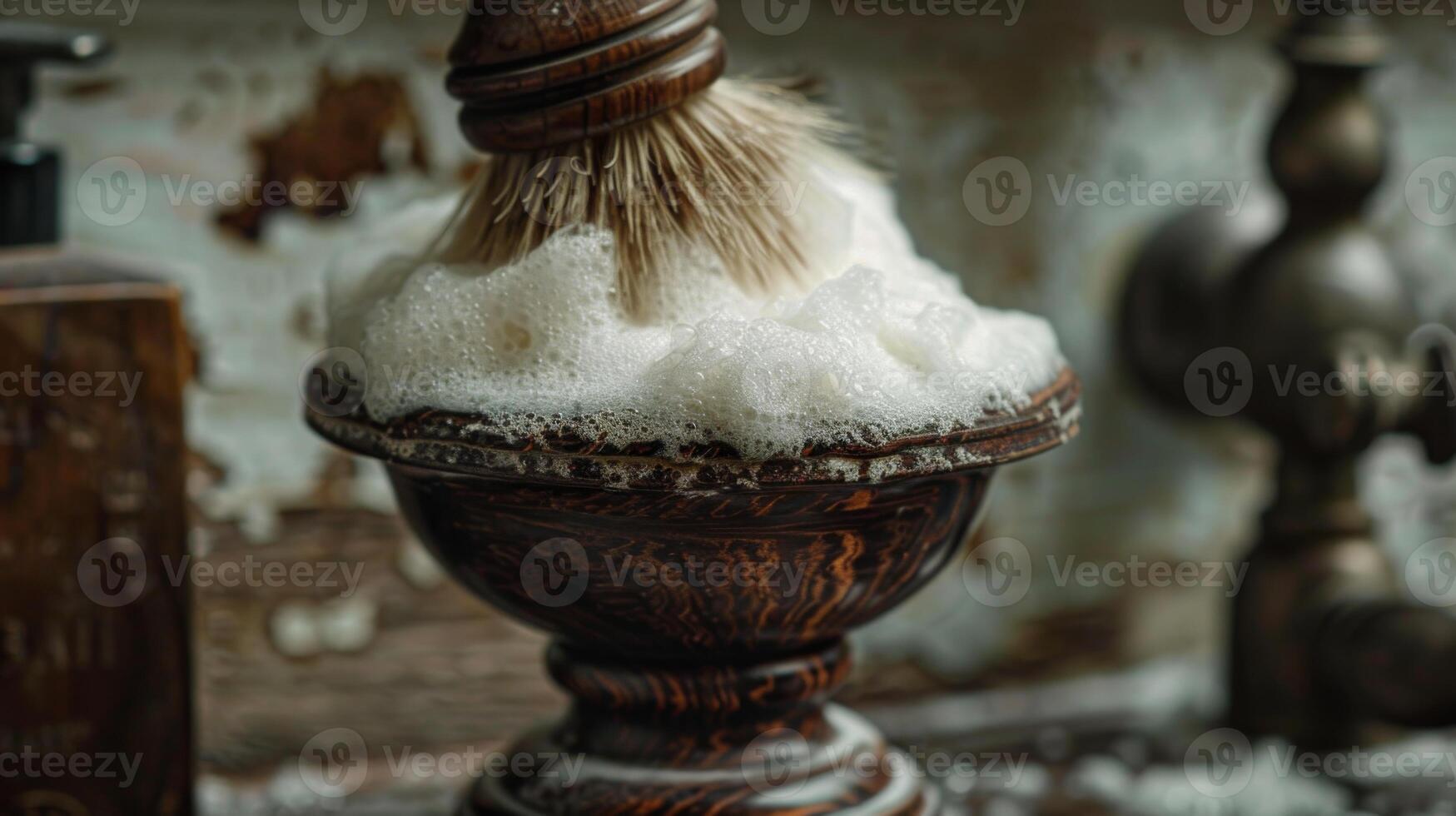 A shaving brush swirls in a dark wooden bowl filled with rich white lather, evoking a classic barbershop atmosphere with rustic decor and warm lighting. photo