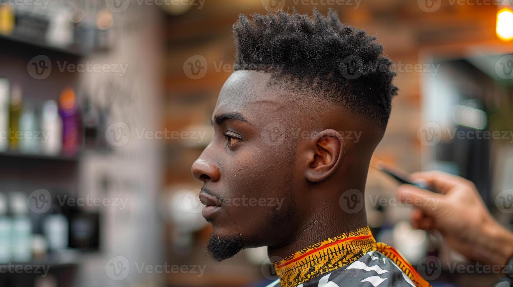 A young man is sitting in a barbershop with a skilled barber giving him a stylish fade haircut. The atmosphere is modern, with a mix of natural light and decorative elements. photo