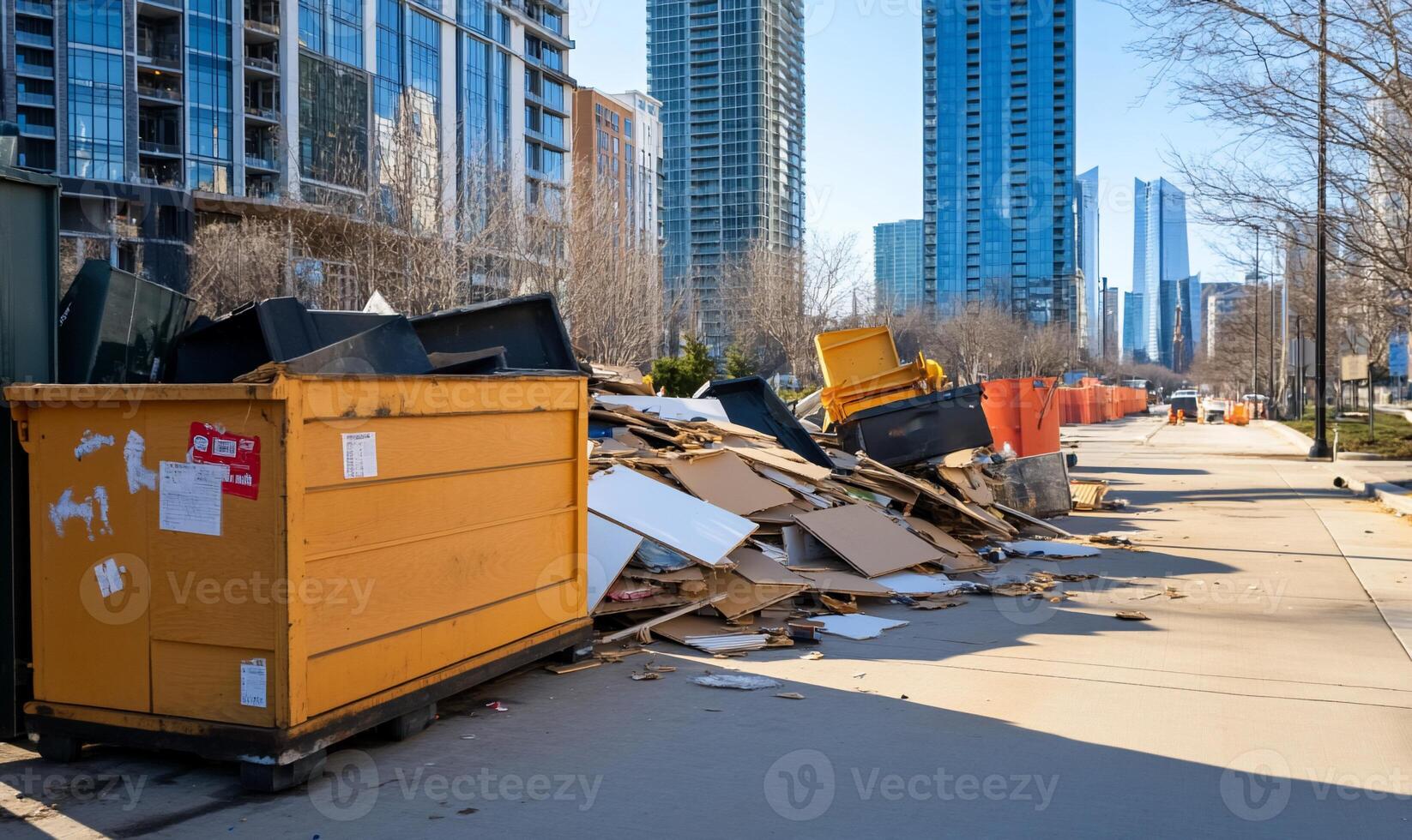 A cluttered urban scene with dumpsters and debris on a sidewalk. photo