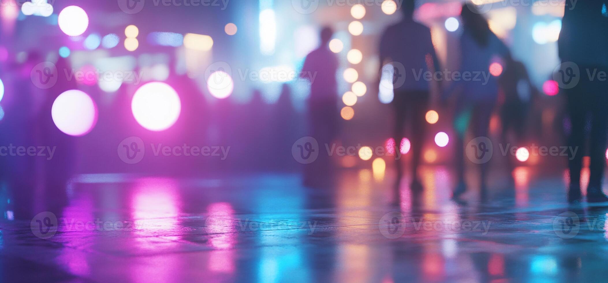 A vibrant nightlife scene with blurred figures and colorful lights. photo