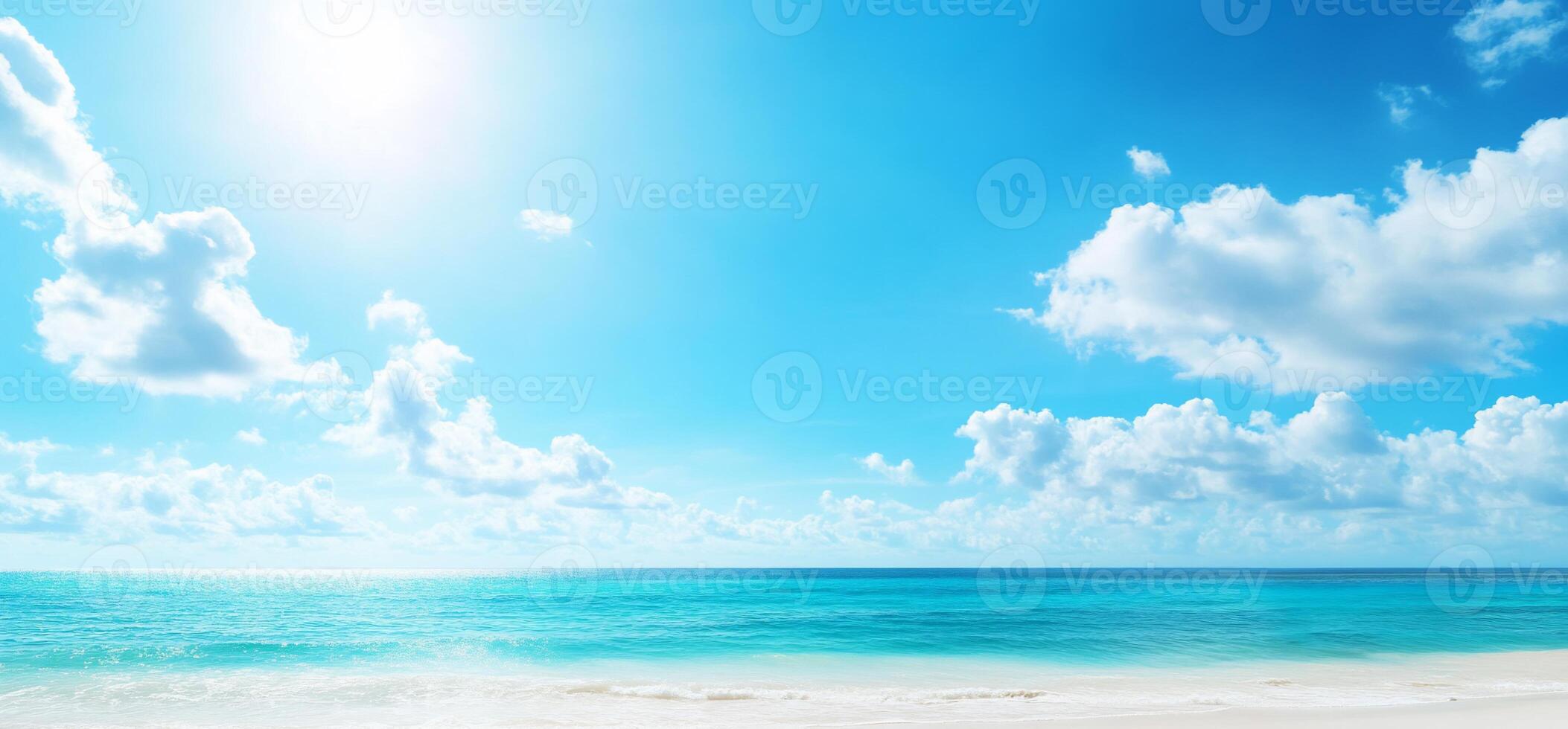 A serene beach scene with clear blue skies and calm ocean waves. photo