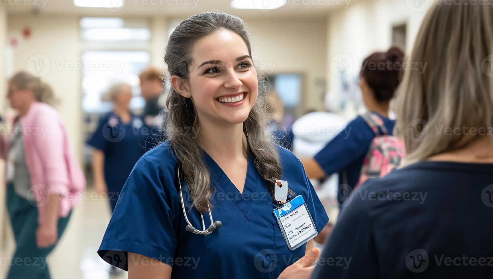 A smiling healthcare worker interacts in a hospital setting. photo