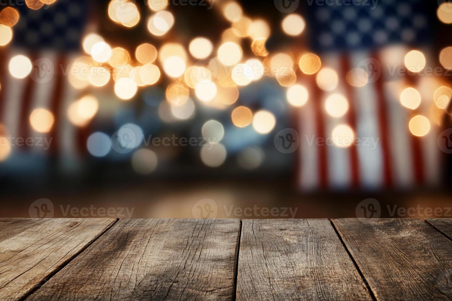 A blurred background with lights and American flags over a wooden table. photo
