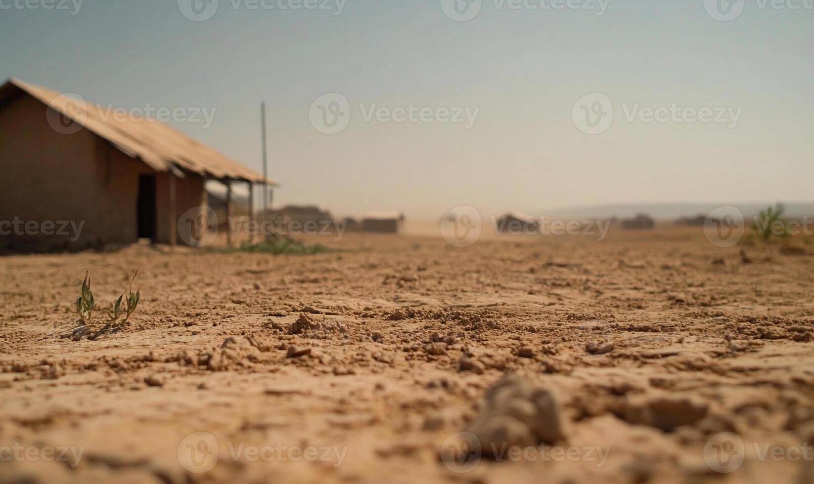 A dusty landscape with a simple structure in a dry environment. photo