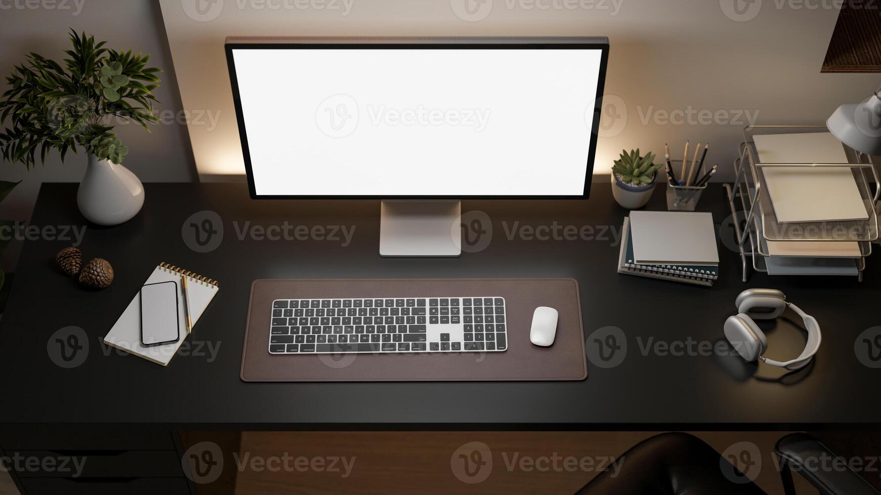 A white screen computer on the black table with decorative items, Workspace from above. photo