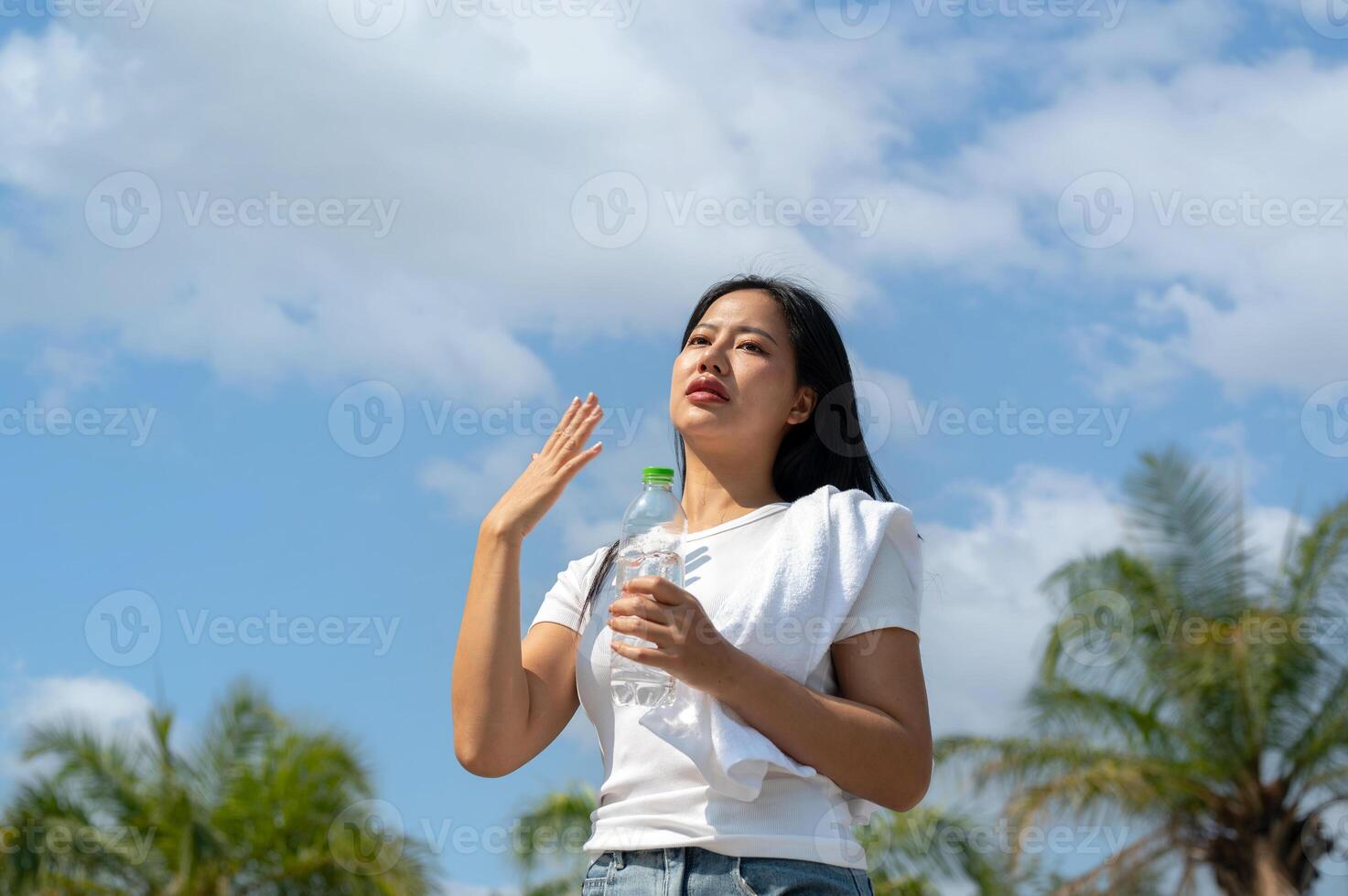 A beautiful women feeling uncomfortable after running under the sun. photo