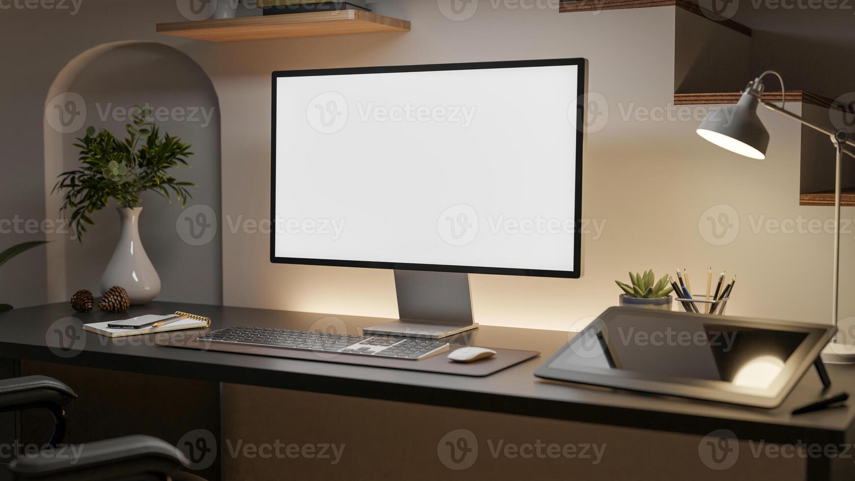 A white screen computer with graphic tablet and decorative item on the wooden table beside the aisle. photo