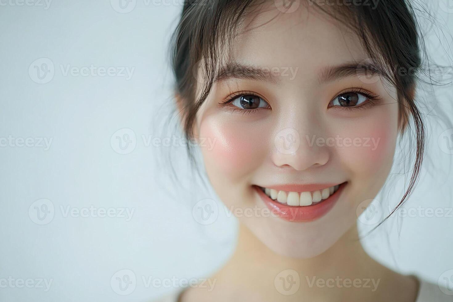 A woman with a pink face and a smile photo