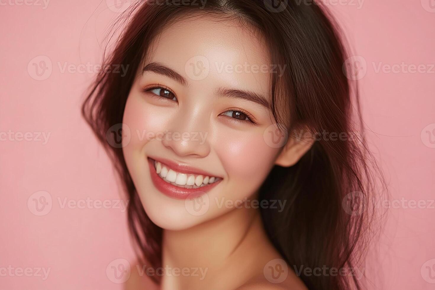 A beautiful young woman with long hair smiling photo