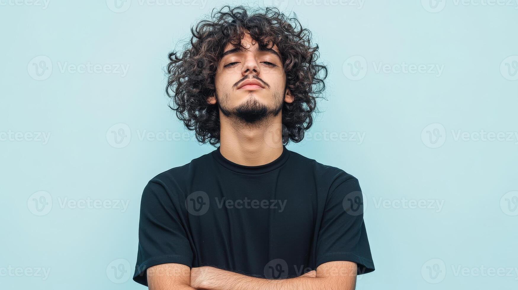 Young Man With Curly Hair Wearing Black T Shirt photo