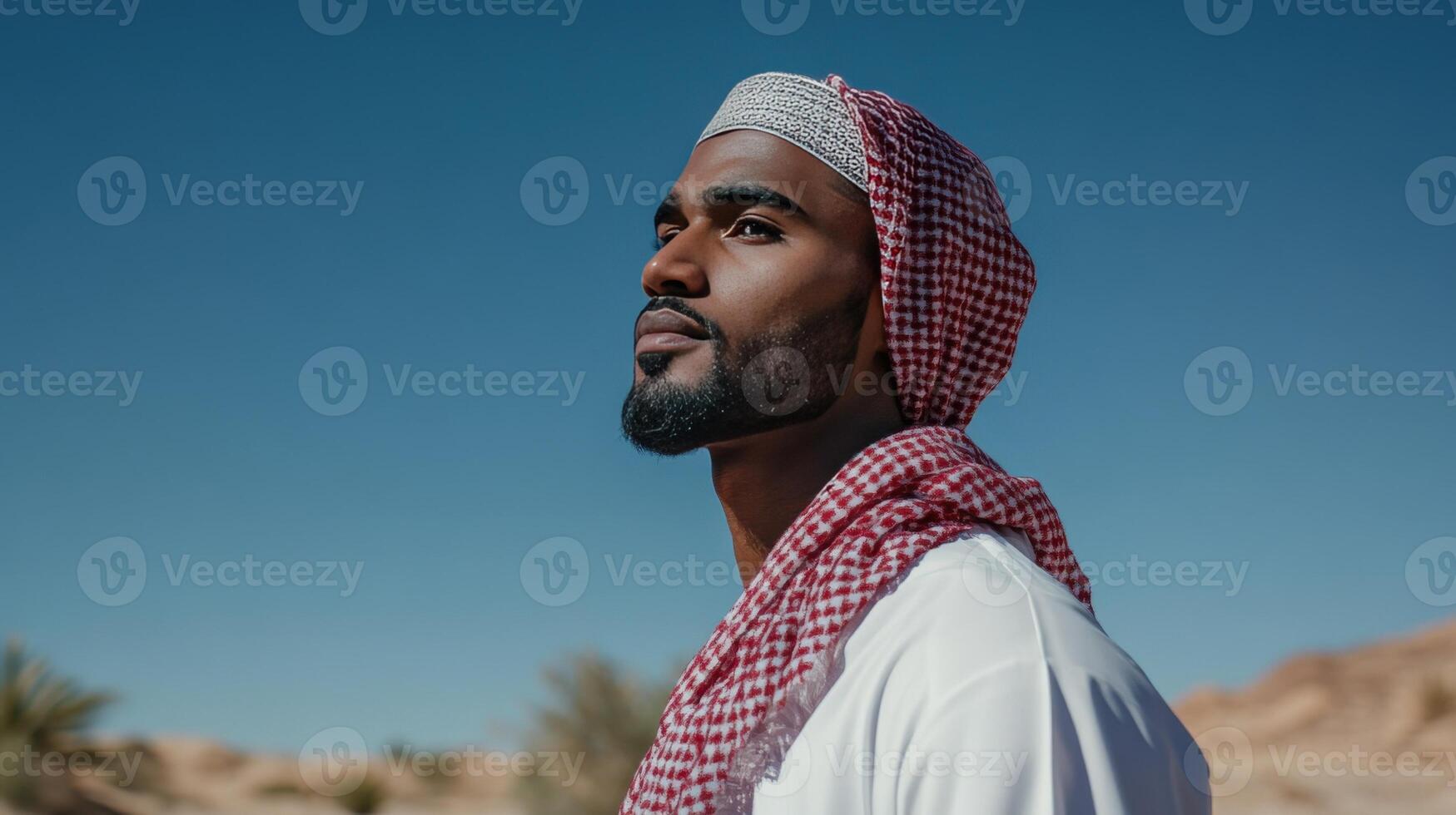 A Young Man Gazes Across The Desert Landscape photo