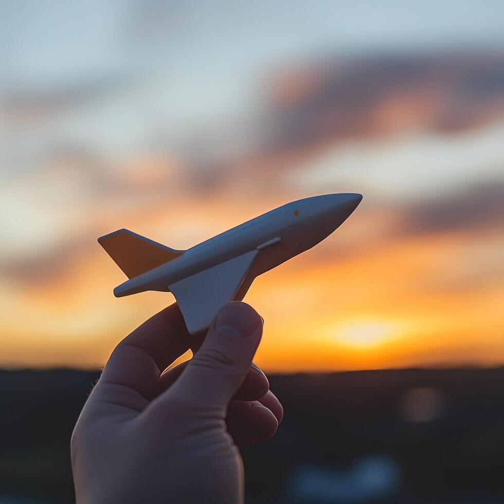 Hand holding airplane photo