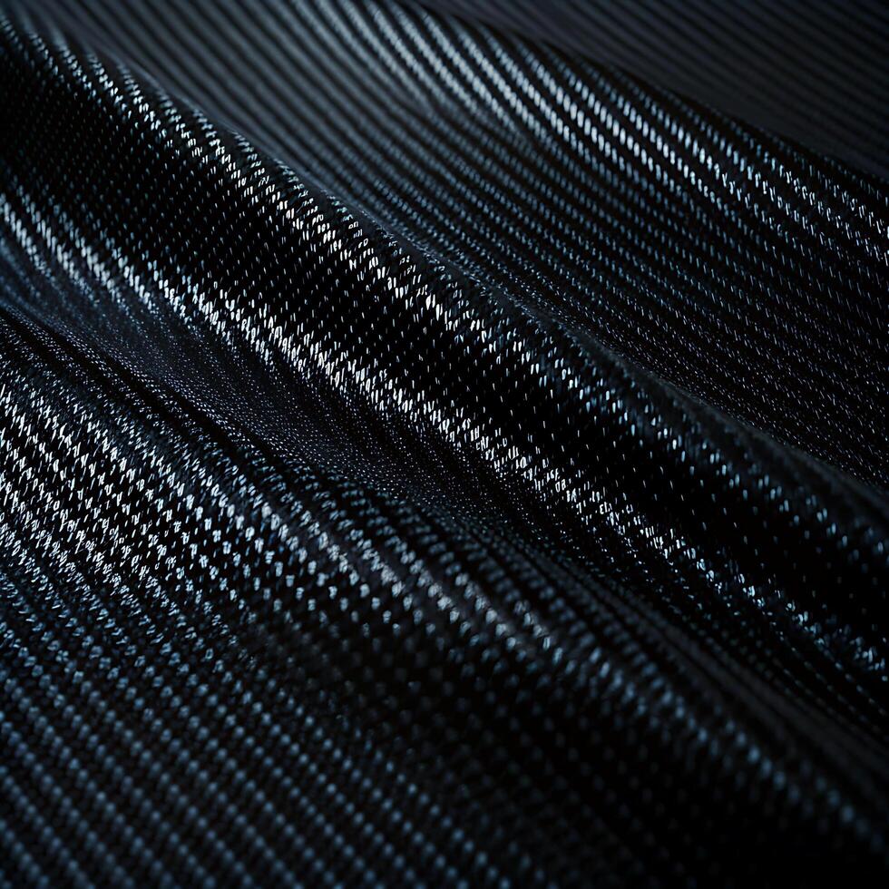 close-up of textured carbon fiber pattern in black photo