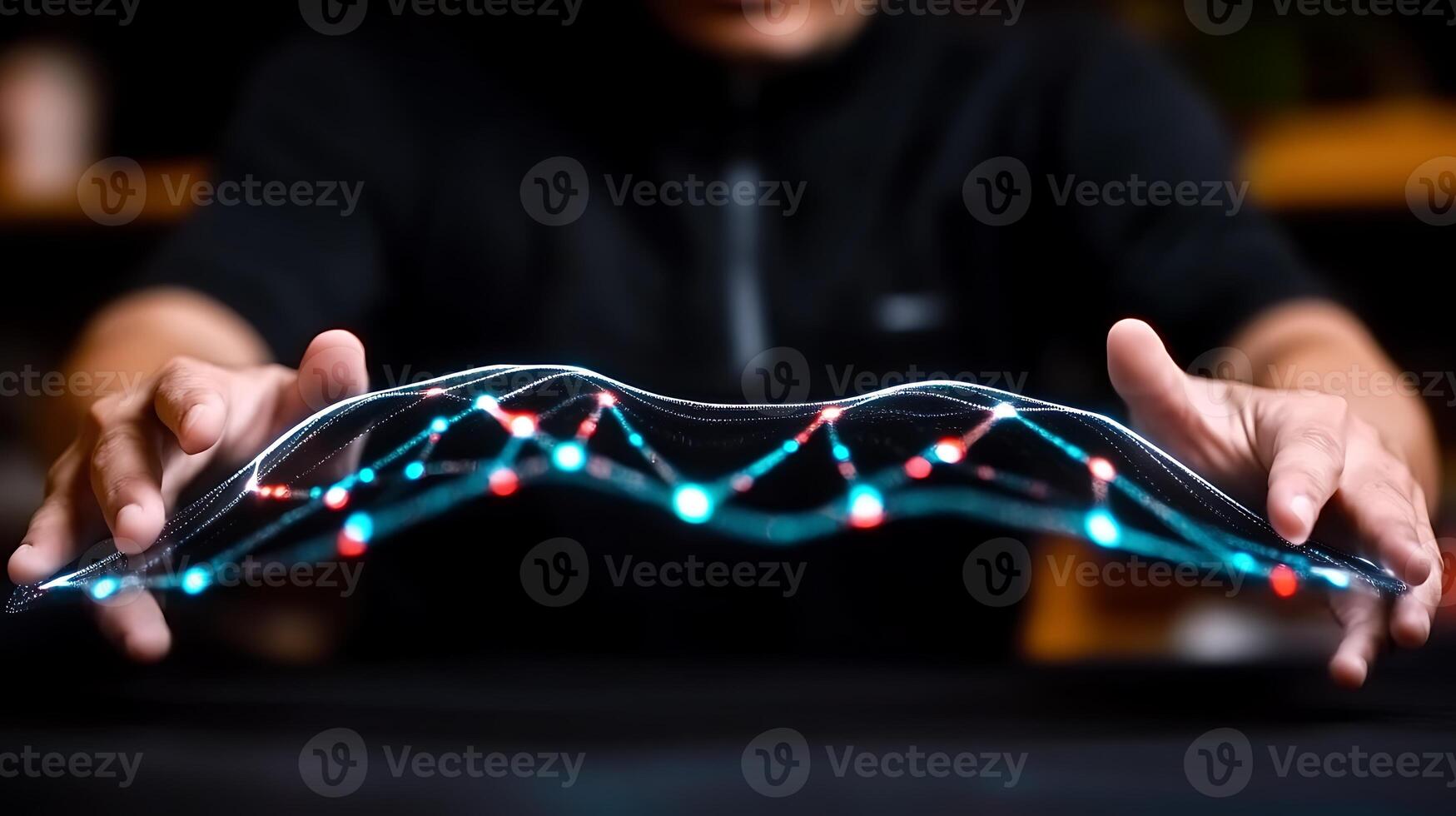 A person manipulating a glowing data visualization with interconnected nodes in a modern workspace photo